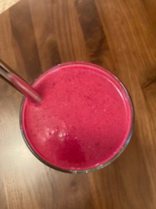 magenta smoothie with metal straw