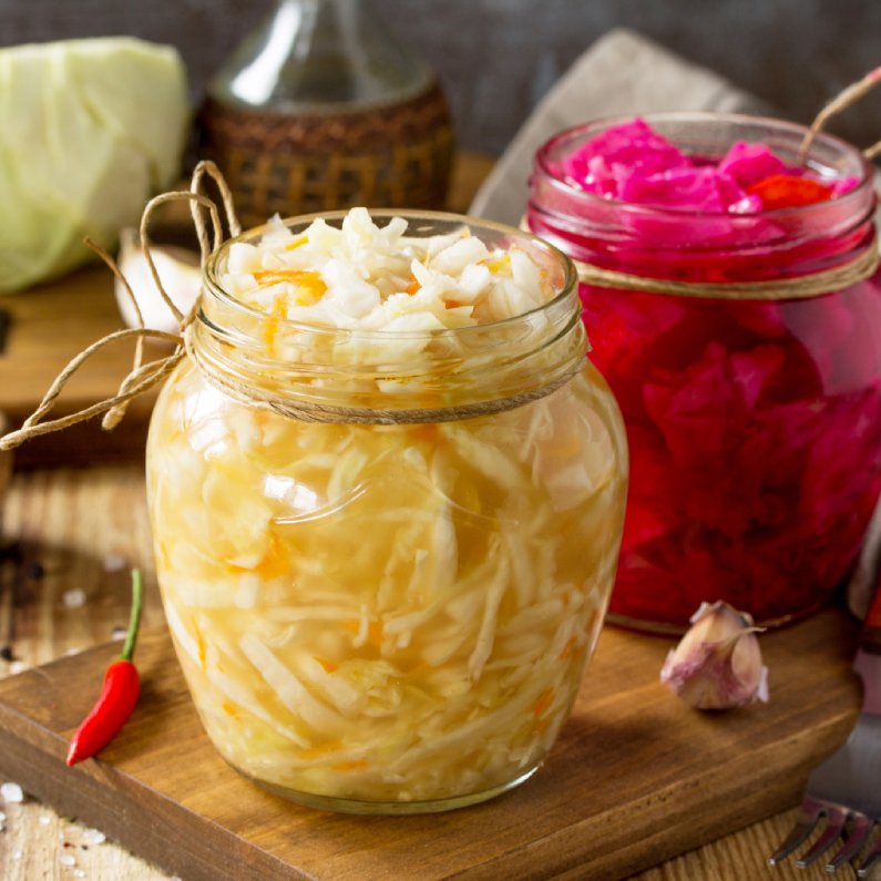 sauerkraut in glass jar. revel +thrive
